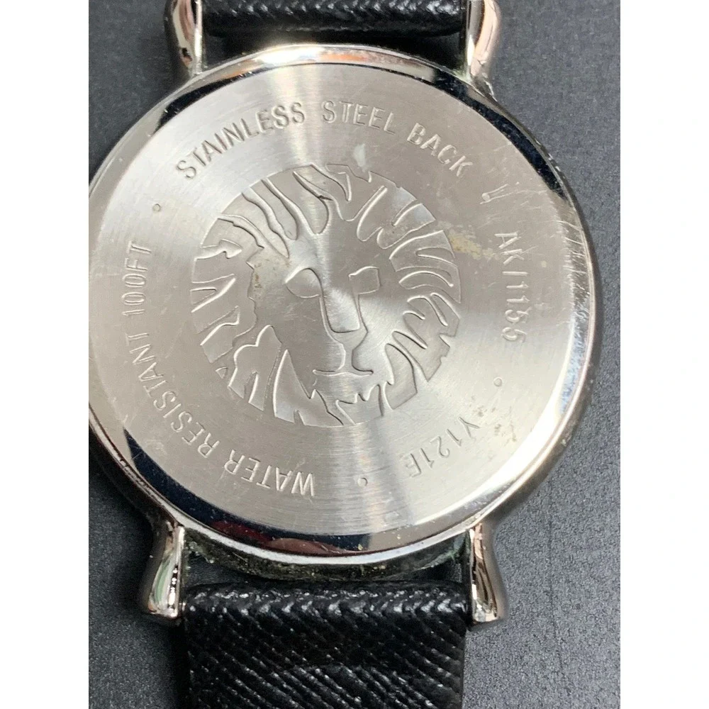 Anne Klein AK/1155 Crystal Bezel Black Dial Leather Strap Watch Womens